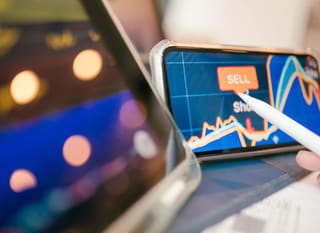 Trader working across multiple markets while reviewing Bitcoin Ethereum and forex options